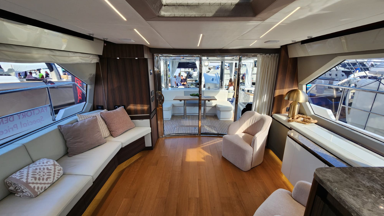 Curved glass doors leading aft desk from the salon of the Aicon Yachts USA Vivere 66